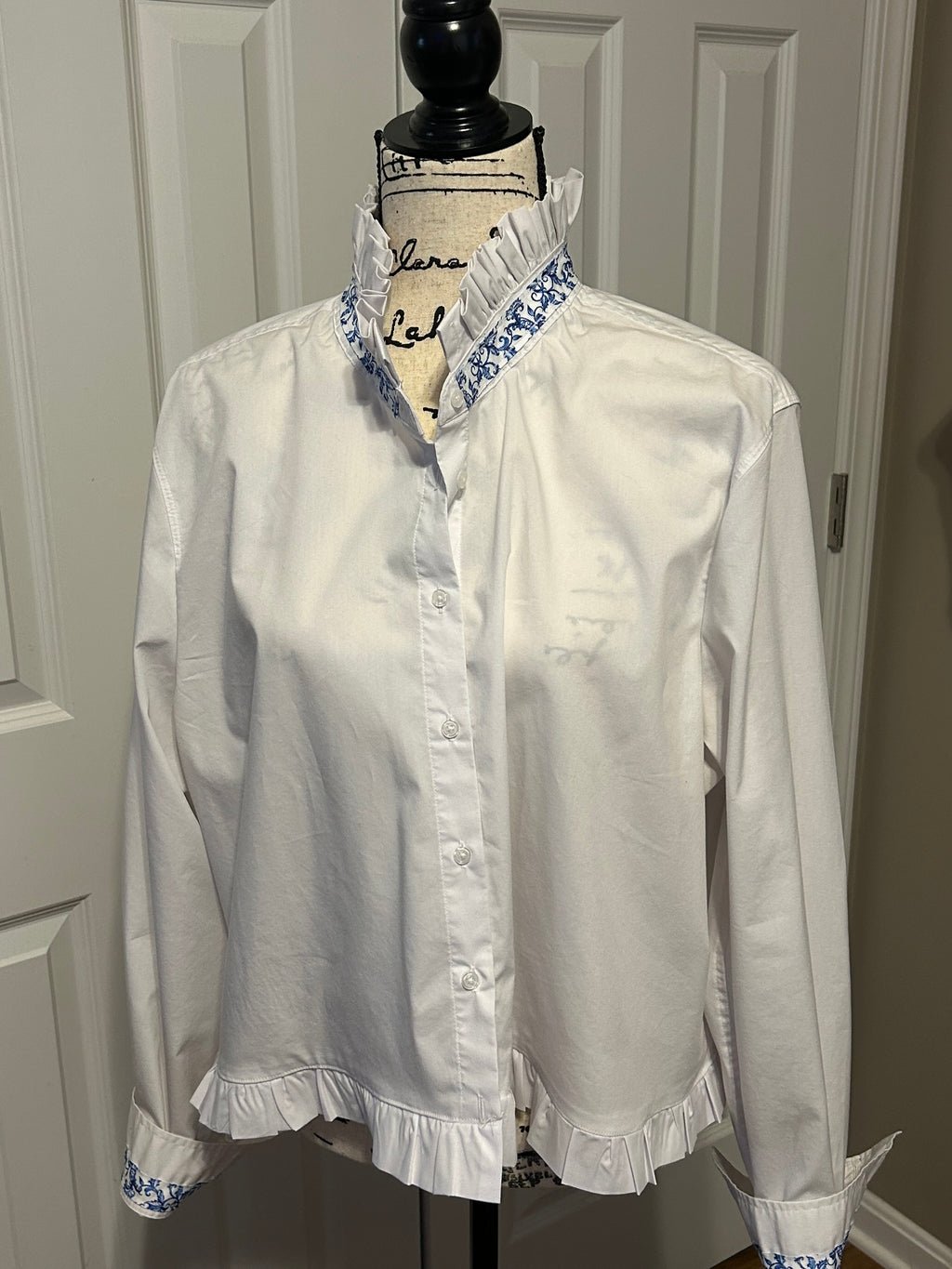 Ladies Up-Cycled White Shirt with White Ruffled Collar and Ruffled Peplum with accents of Blue and White Floral Print.  Size XXL