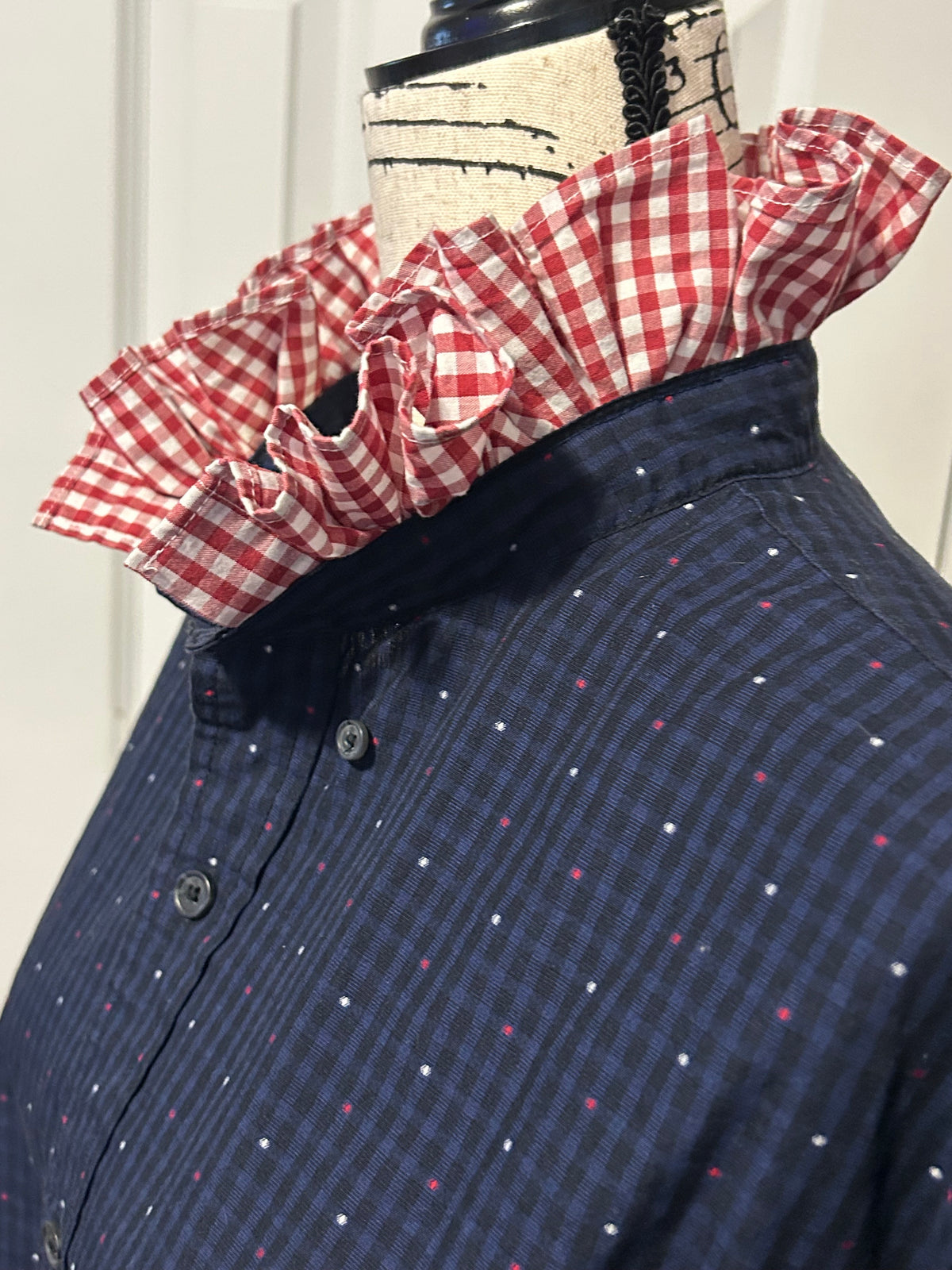 Ladies Up-Cycled Chaps Navy Blue with Little Blips of Red, White and Blue colors with a Ruffled Red Check Collar. Size XL.